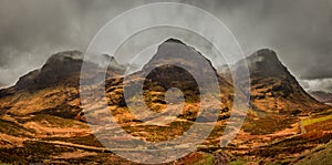 A moody panoramic of the Three Sisters mountains in Glencoe. Scotland