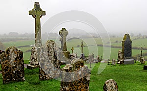 Moody scene of Celtic crosses and gravestones, historic Rock Of Cashel,Ireland,2014