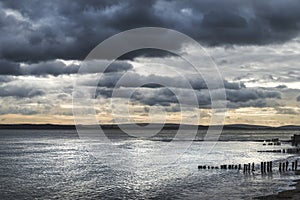 Moody sea landscape looking across Solent to Isle of Wight in En