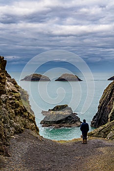 Moody skies and a dramatic rocky coastline in Pembrokeshire, Wales