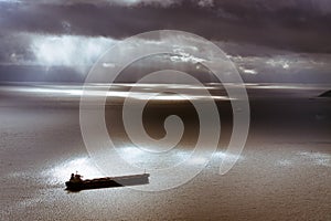 Moody sky and Mediterranean Sea with ship leaving Gibraltar