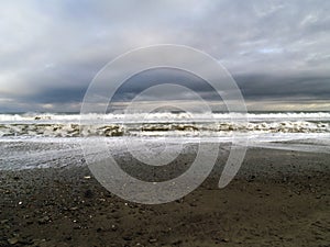 Moody sky over ocean coastline