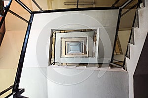 A moody stairwell taken from the down view