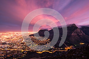 Moody Table Mountain and the city of Cape Town.