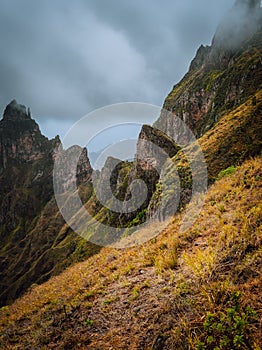 Moody view of Xo-Xo Valley, Santo Antao Island, Cape Verde Cabo Verde. Rugged mountain peak overgrown with verdant grass