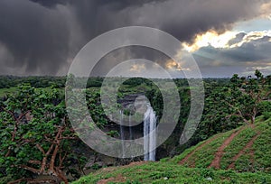 Moody Waterfall under Overcast Dark Clouds