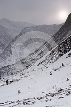 Moody weather in winter mountain landscape