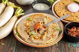 Mooli Paratha, A Stuffed Indian flatbread with spiced radish filling, flavorful and wholesome. photo