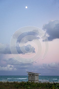 The moon above a hut on Miami Beach