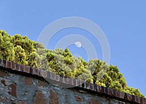 The moon above the walls of the castle at Le Suquet, Cannes photo