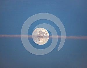 Moon with aircraft contrail
