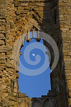 The Moon through an arched window