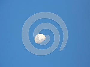 A moon in the blue sky