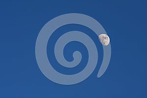 Moon in blue sky without clouds