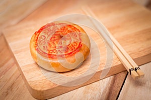 Moon cake,Chinese mid autumn festival dessert. on wooden table