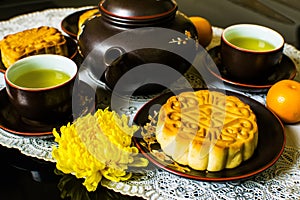 Moon cakes for the Chinese Mid-autumn festival isolated on black background.