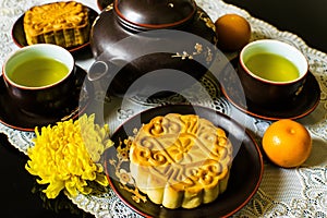 Moon cakes for the Chinese Mid-autumn festival isolated on black background.