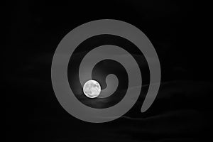 Moon between the clouds in black and white full moon halloween monthly cycle astrology