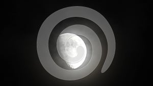 Moon with clouds in the night sky. Cloudy weather on a autumn night. Mysterious night sky with moon. Spooky night and mystery. Dr