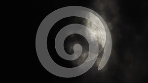 Moon with clouds in the night sky. Cloudy weather on a autumn night. Mysterious night sky with moon. Spooky night and mystery. Dr