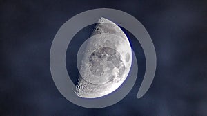 Moon and clouds in sky over telescope