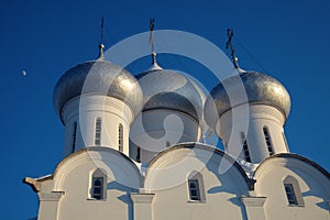 Moon and cupola of Sophia cathedral in Vologda Kremlin, Russia