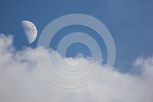 The Moon in the Day time with Blue sky background