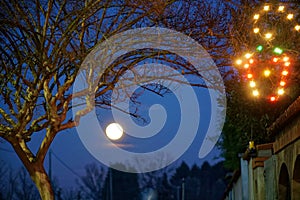 Moon at deep night and black sky and lights