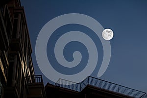 Moon and house roof