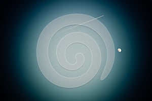 The Moon and jetliner in the lens