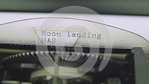 Moon Landing has been faked Electric typewriter typing on white paper.