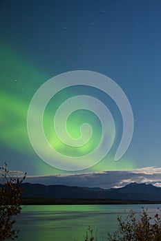 Moon-lit clouds northern lights over Lake Laberge