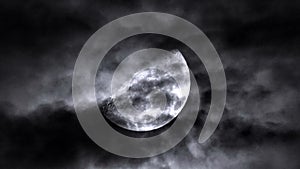 Moon in cloudy sky and dramatic dark clouds