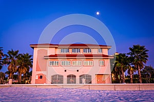 Moon over building and the beach at night in Clearwater Beach, F