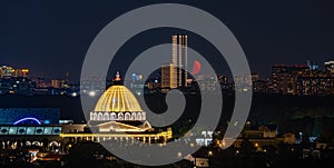 Moon over the city at night. Moscow