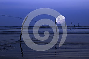 Moon over ocean, night scene