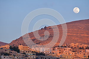 Moon over Wadi Musa, Jordan photo
