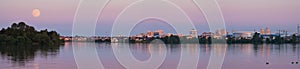 Moon perigee seen from Minsk, Belarus. City Scape at evening scene with super moon. Fullmoon in Minsk, panoramic view of the city photo