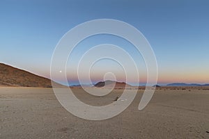 Moon rise as the sun set in Namib Desert