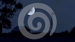 The moon rises over an abandoned farm in South Dakota