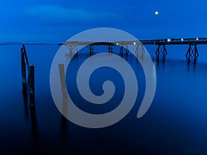 Moon rises over the fishing pier in Sidney, Vancouver Island, Br photo