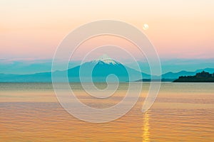 Moon rising over Lake LLanquihue and Osorno Volcano