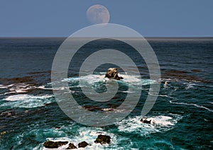 Moon setting Asilomar State Marine Reserve California