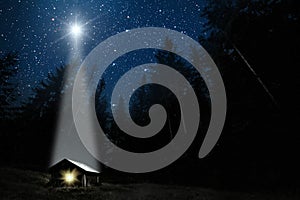moon shines over the manger of christmas of Jesus Christ photo