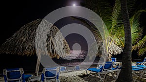 The moon shining above a beach in Punta Cana