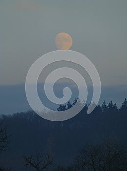 Moon shining on the evening sky