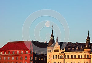 Moon in the sky, Dawn, Spring panorama of Helsinki, view on   rooftops of Krununhakka buildings