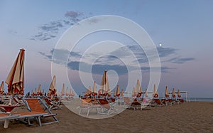 at sunset on the golden beach of bibione photo