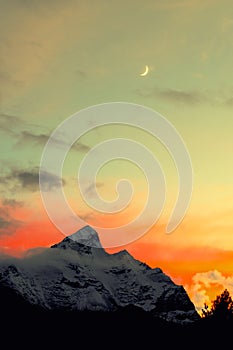 Moon and snow mountain