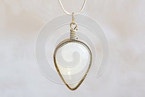 moon stone sterling silver simple pendant on neutral background